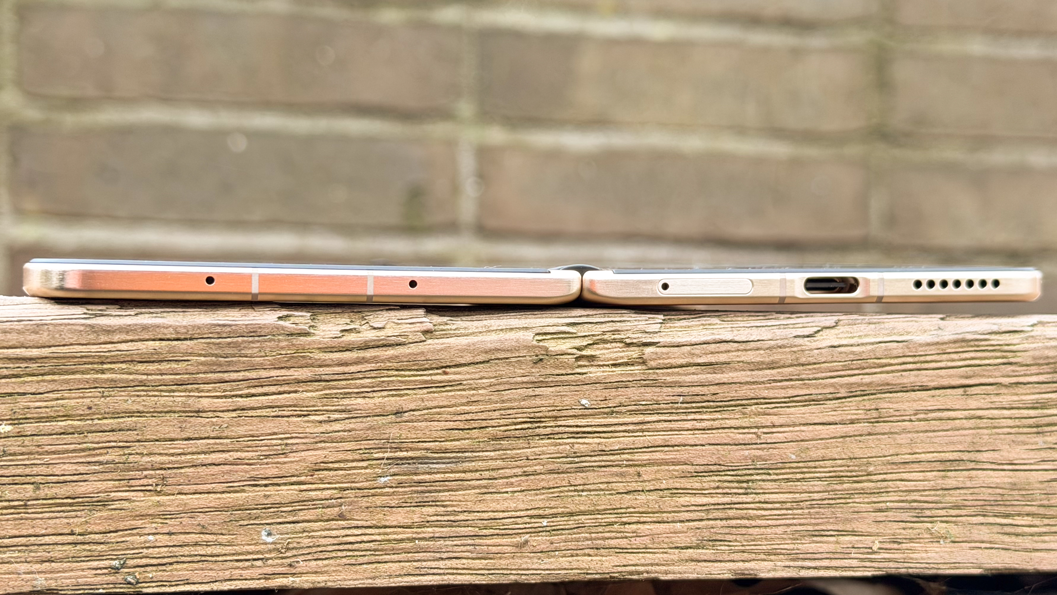 Side profile view of the Honor Magic V6 fully unfolded, demonstrating its blade-thin design.