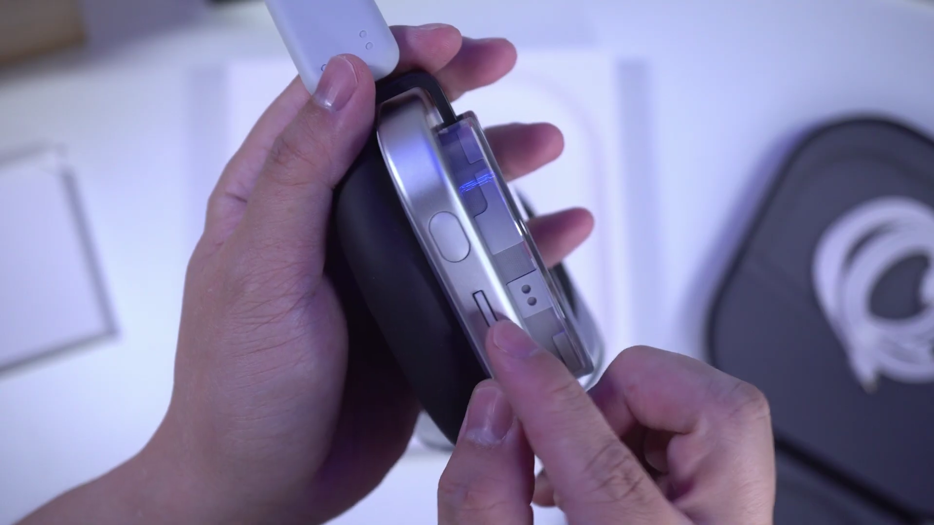 Nothing Headphone (1) placed next to a Nothing Phone showing the ChatGPT integration interface.