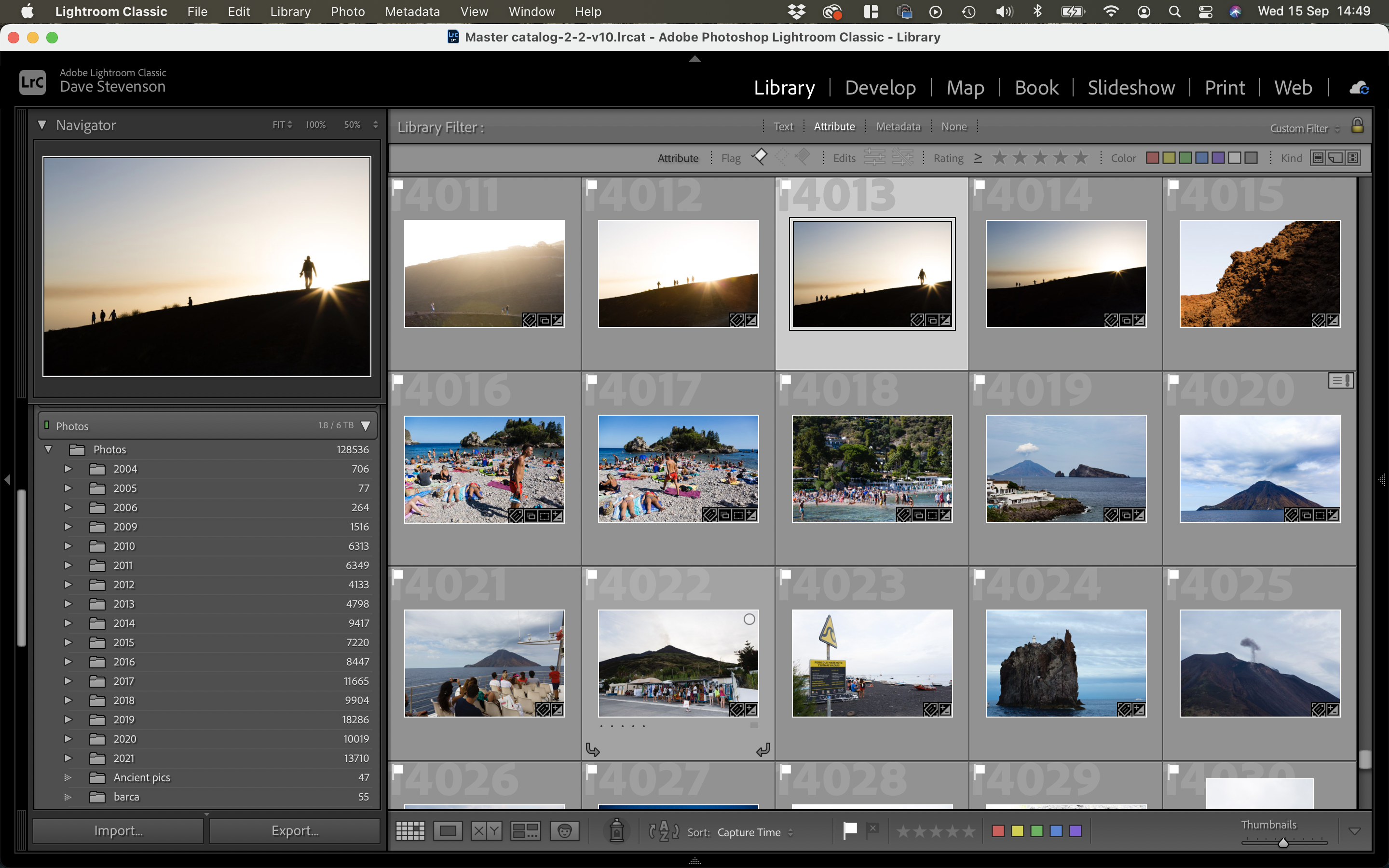 A computer screen showing the Adobe Lightroom interface with a grid of organized photos.