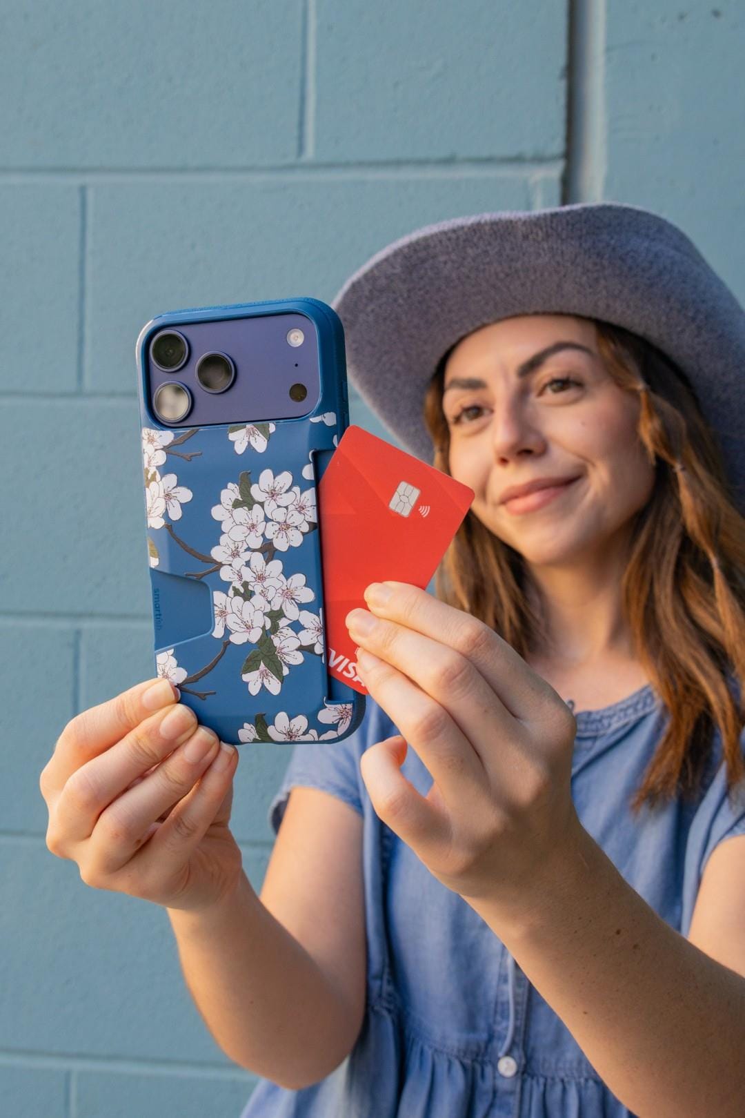 Front and back views of the iPhone 17 Pro Max in teal and cherry red.