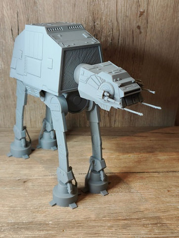 A 3D printed AT-AT Walker toy with a spring-like flexible midsection.