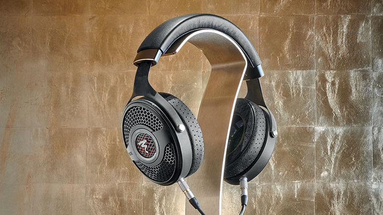 The Focal Utopia headphones resting on a premium headphone stand.