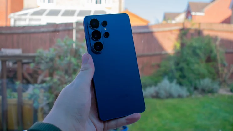 The rear of the Galaxy S26 Ultra in Cobalt Violet, highlighting its rounded corners and camera array.