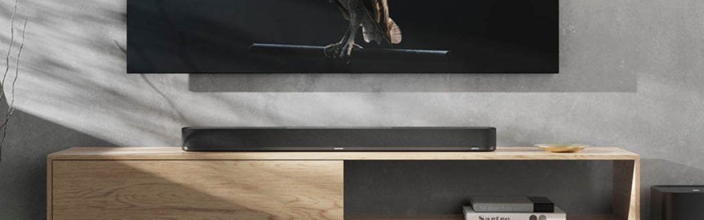 Sennheiser Ambeo soundbar placed in a sophisticated living room environment.