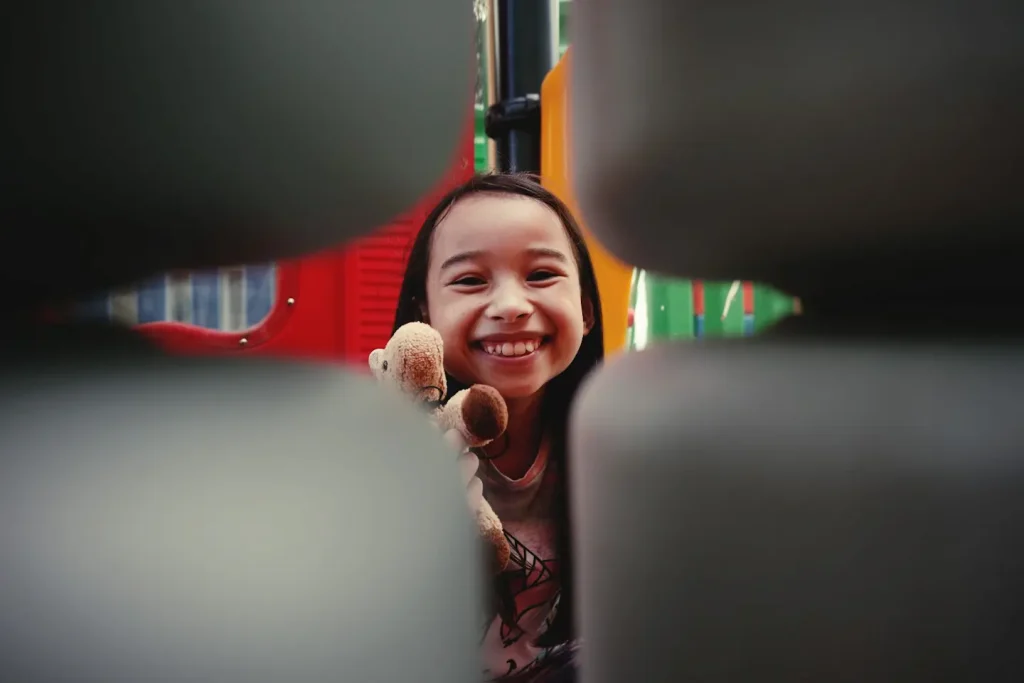 A portrait of a young girl with a soft, blurred background.