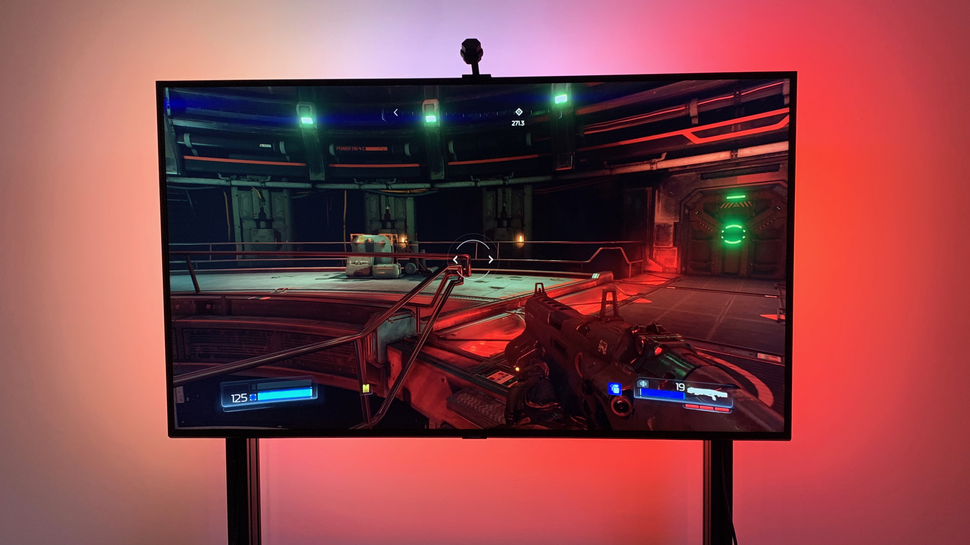 A smart lighting demonstration showing vibrant colors extending from a television screen.