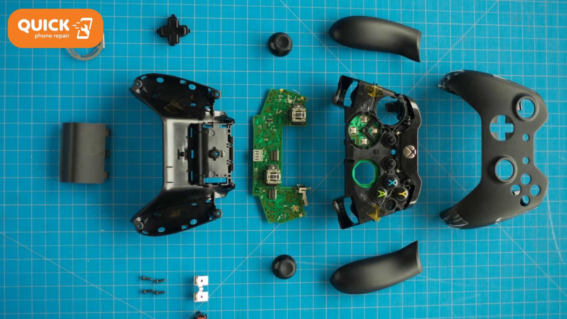 A hand wiping down a game controller with a cleaning cloth.