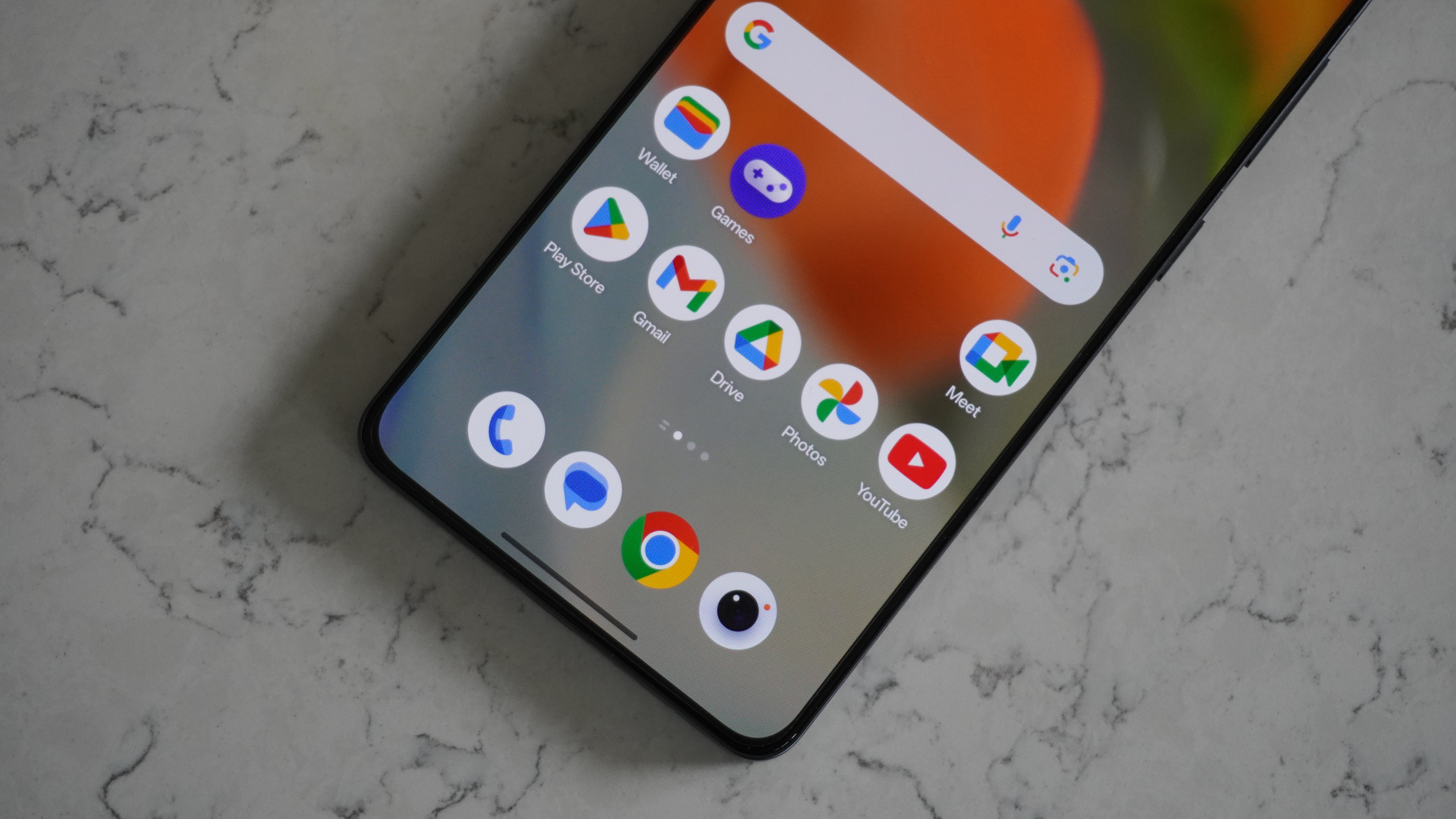 Close-up of the OnePlus 13R screen displaying the OxygenOS 15 user interface.