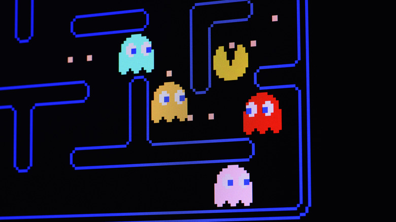 Digital pixel art of Pac-Man and the colorful ghost characters.