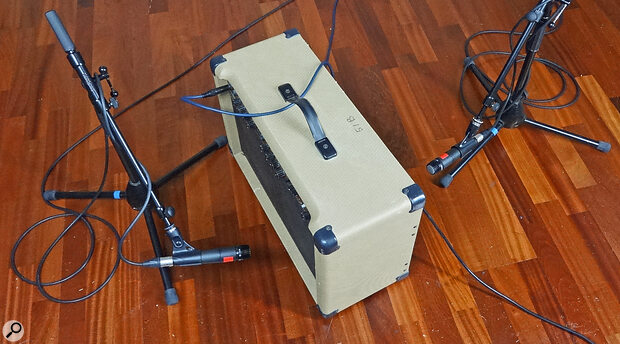 Two microphones positioned on opposite sides of a single instrument.