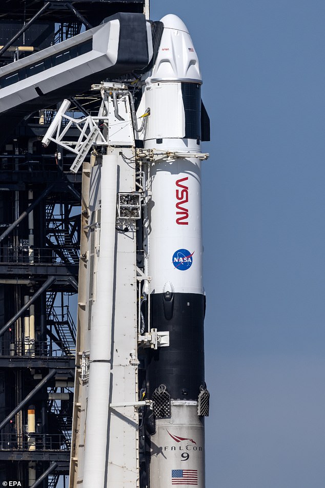 The SpaceX Dragon Capsule in flight against the blackness of space.