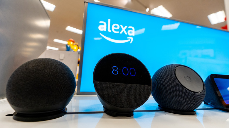 Amazon Alexa-enabled devices on display in a retail electronics department.