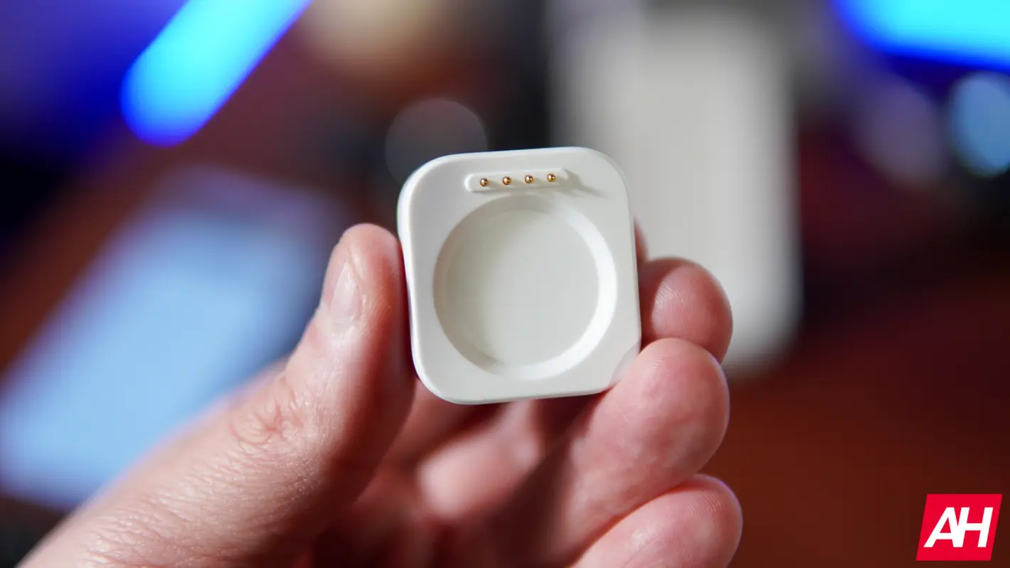 A full top-down view of the OnePlus Watch 2 with its black silicon strap.