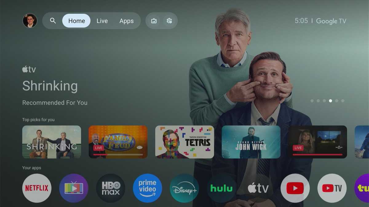 Screenshot of the Google TV home screen interface on a television with various streaming app icons.