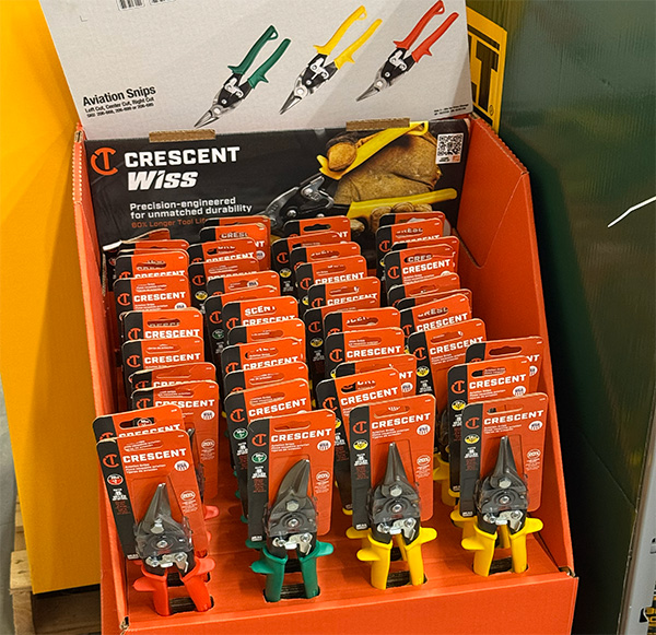 Display of adjustable wrench sets in a retail holiday tool section.