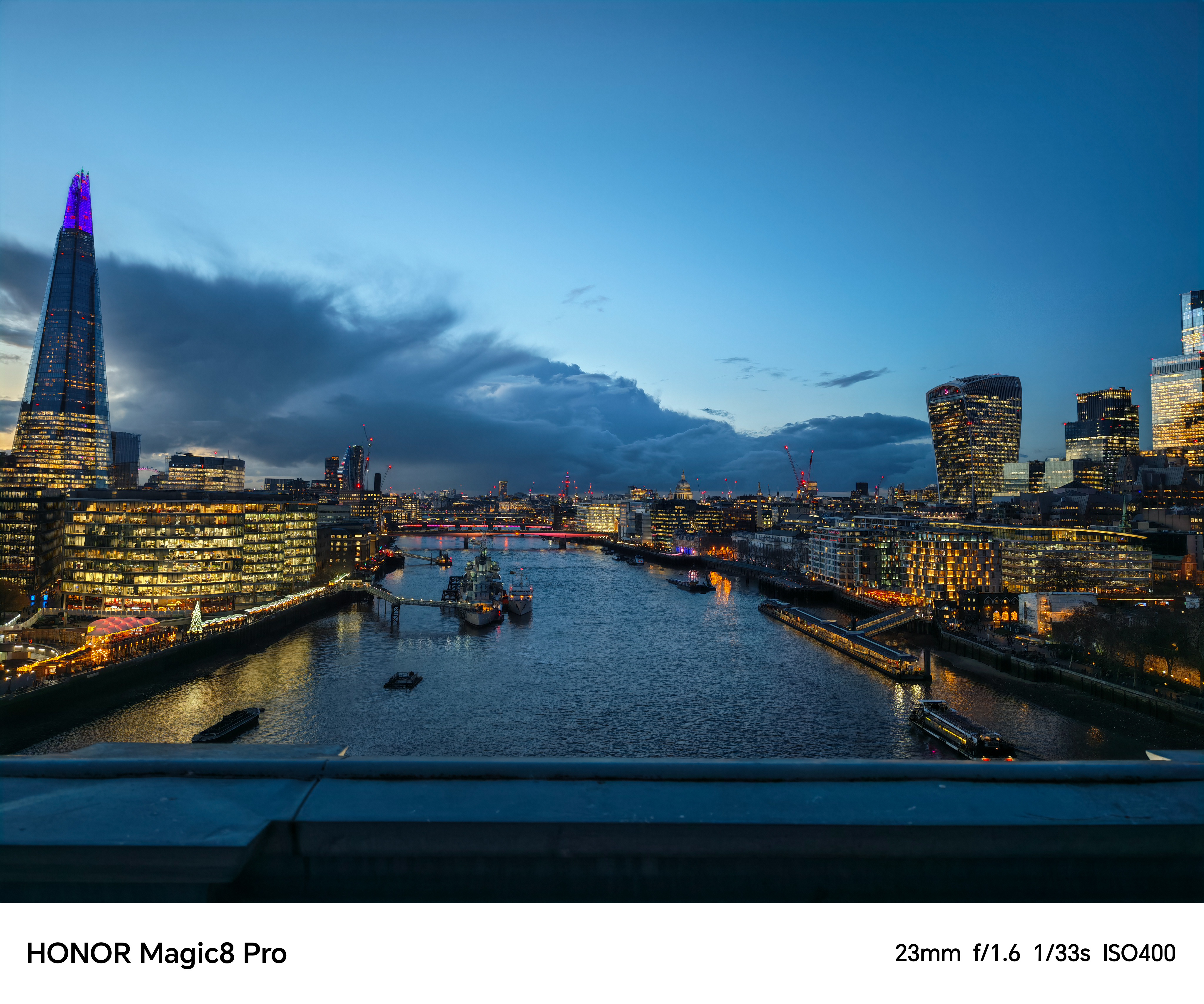 Night view of the River Thames and Tower Bridge with clear lights and reflections.