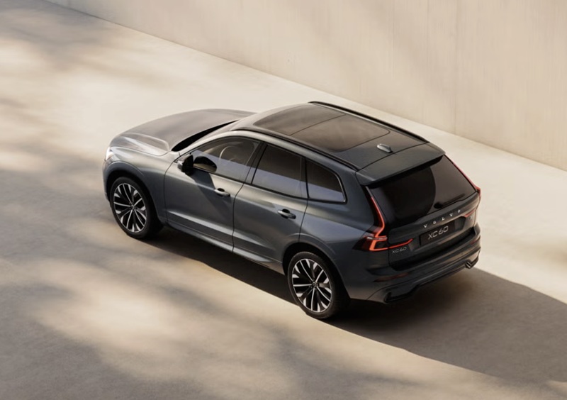 Rear three-quarter view of the 2026 Volvo XC60 highlighting the darkened taillight shrouds.