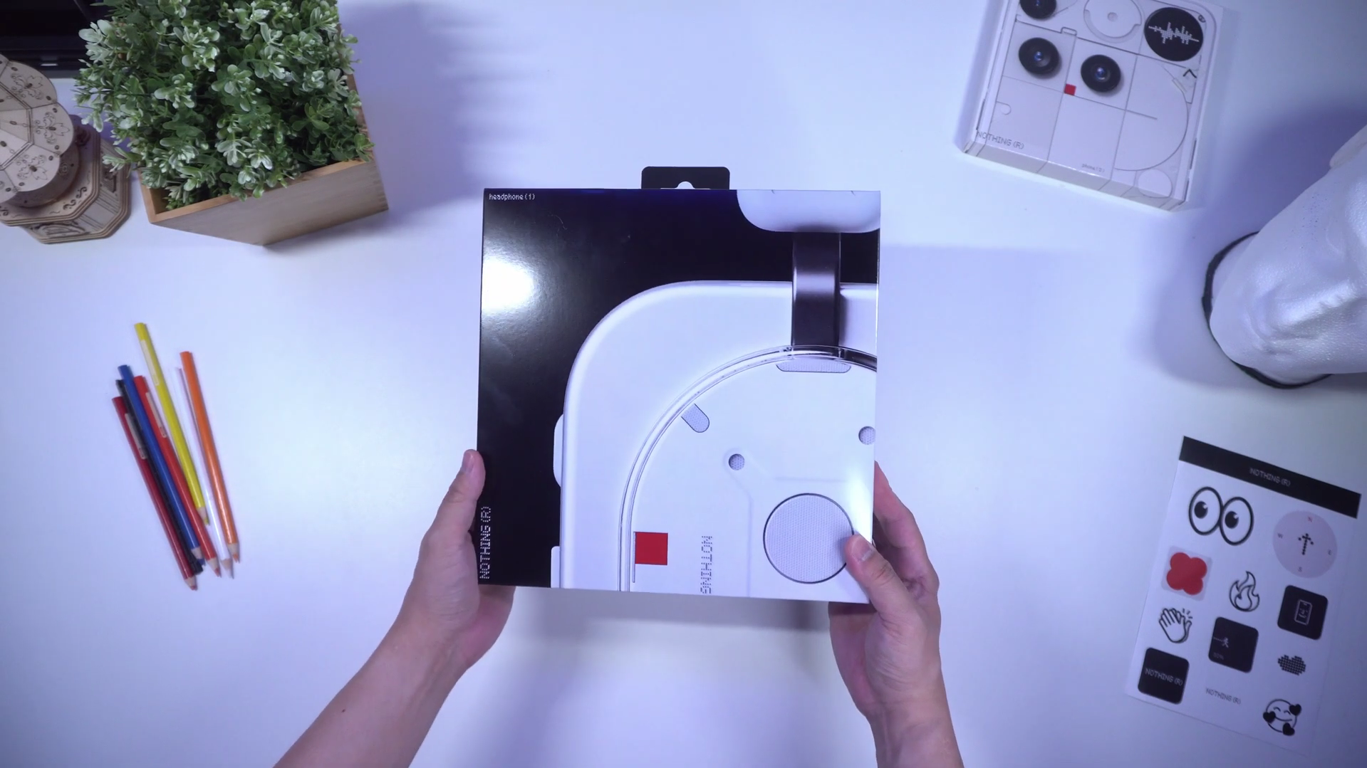 Detailed view of the red paddle rocker and physical dial on the Nothing Headphone (1).