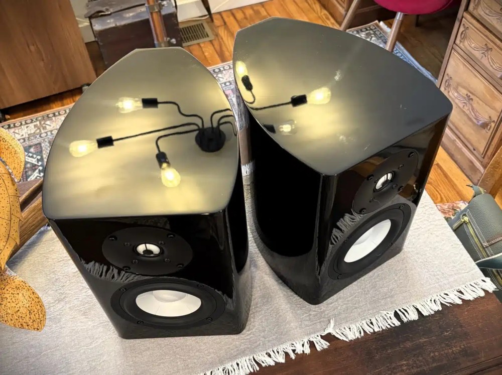 A Philharmonic Audio Ceramic Mini bookshelf speaker with a visible white driver and clean wood finish.