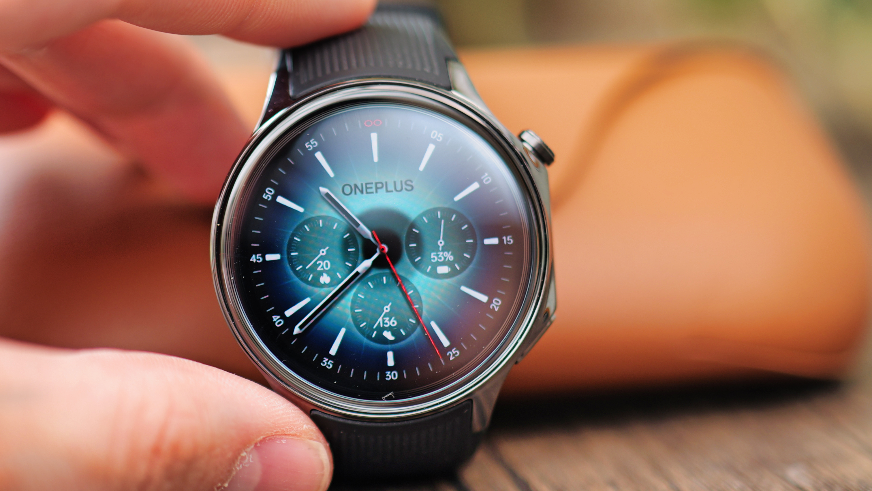 The circular AMOLED display of the OnePlus Watch 2 showing health and performance metrics.