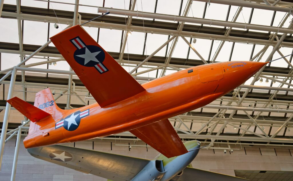 The orange Bell X-1 'Glamorous Glennis' supersonic aircraft.