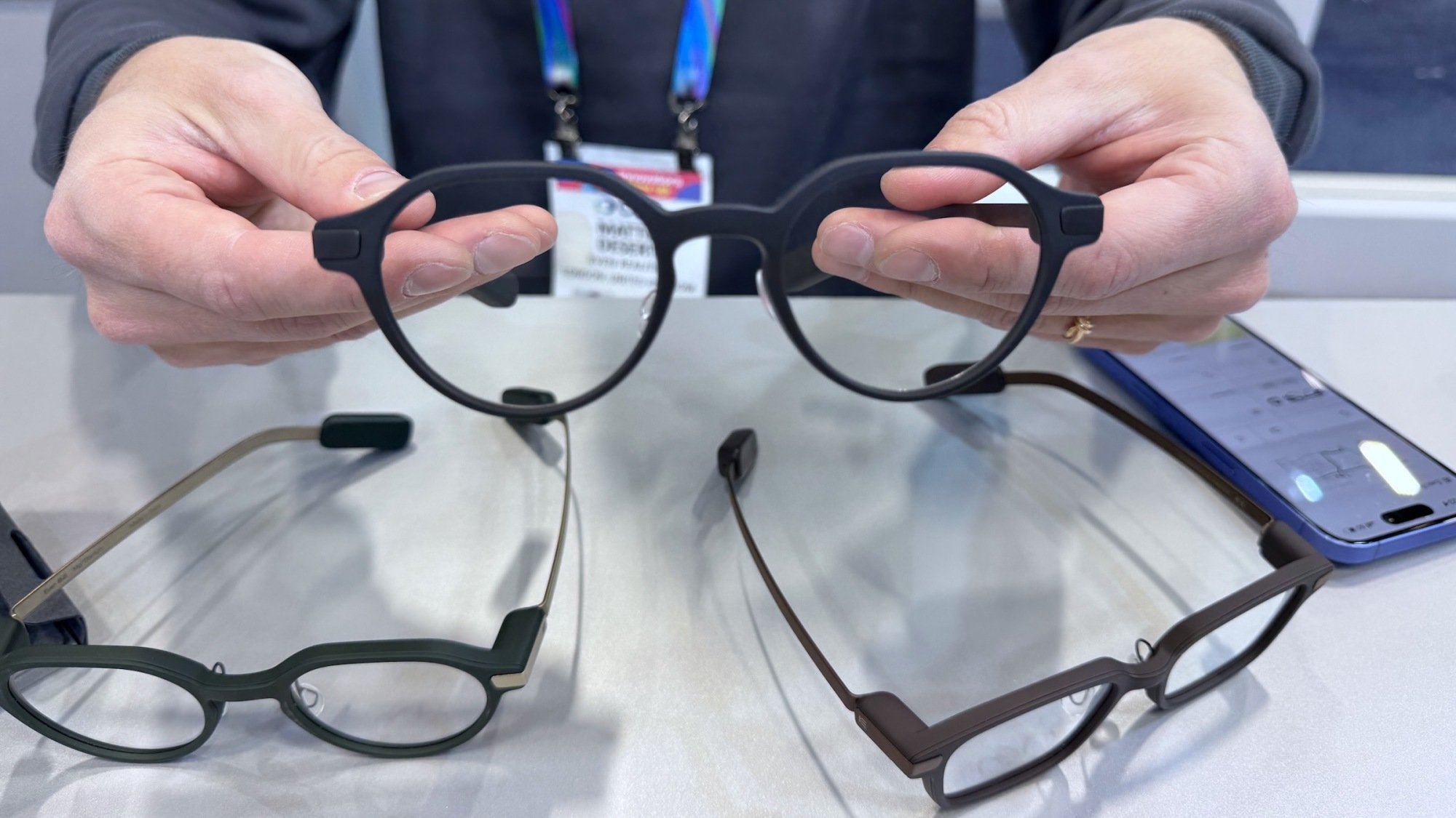 Three different styles and colors of Even Realities G2 smart glasses lined up.