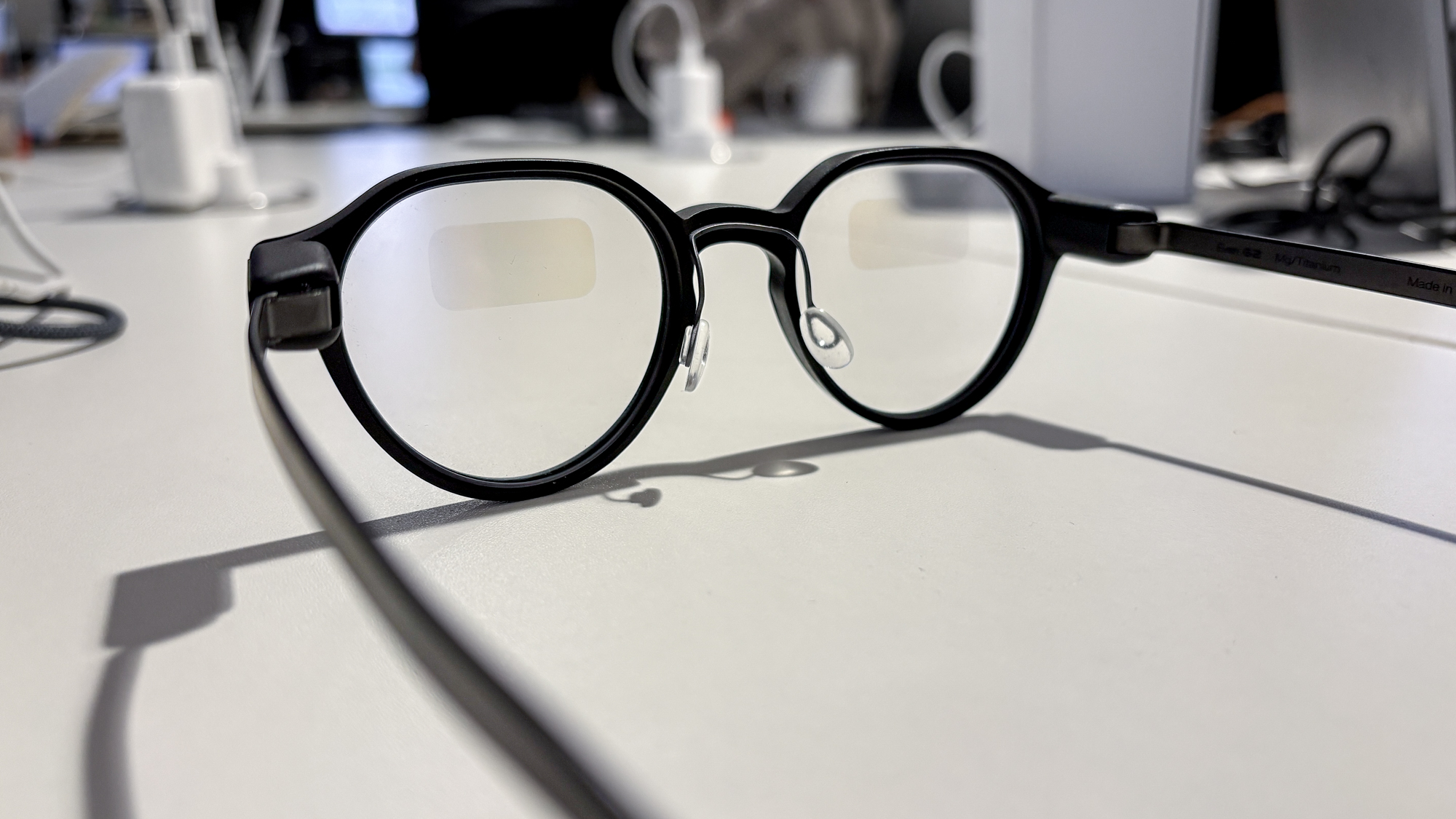 Even Realities G2 smart glasses folded and placed inside their protective charging case.