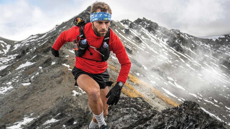Garmin Enduro 3 worn by a climber on a mountain.