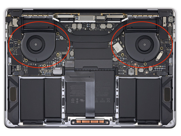 Detailed view of the internal dual-fan cooling system inside a MacBook Pro chassis.