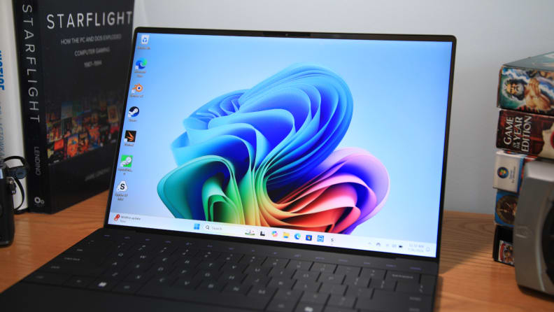 Close-up of the Dell XPS 13 screen showing vibrant, colorful abstract wallpaper.
