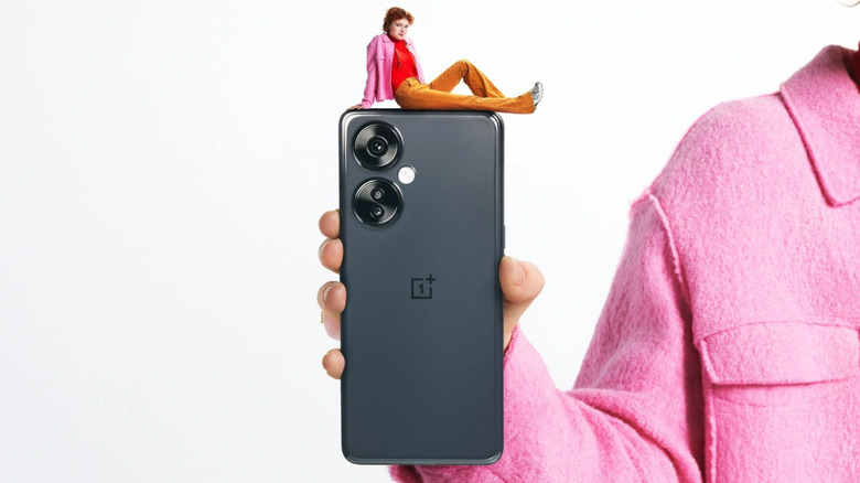 Gray OnePlus Nord N30 in a man's hand