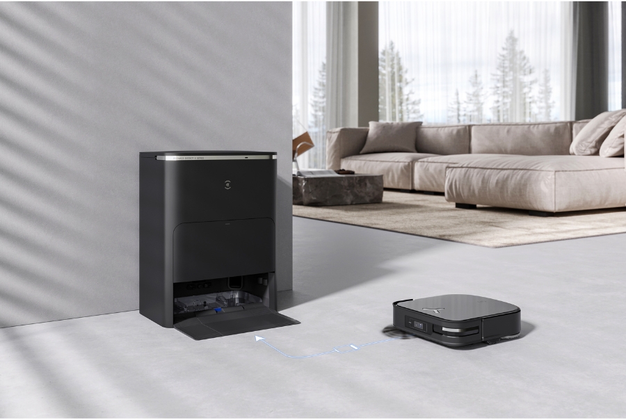 A robot vacuum cleaner perfectly aligned and docked at its automated cleaning station.