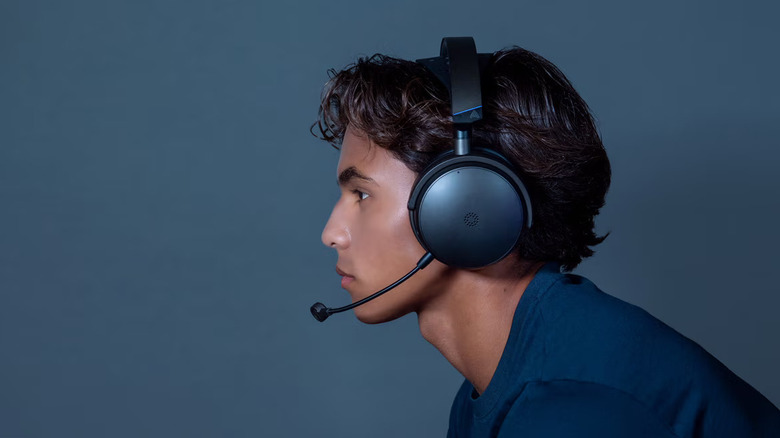 A person wearing the Audeze Maxwell 2 wireless headphones.