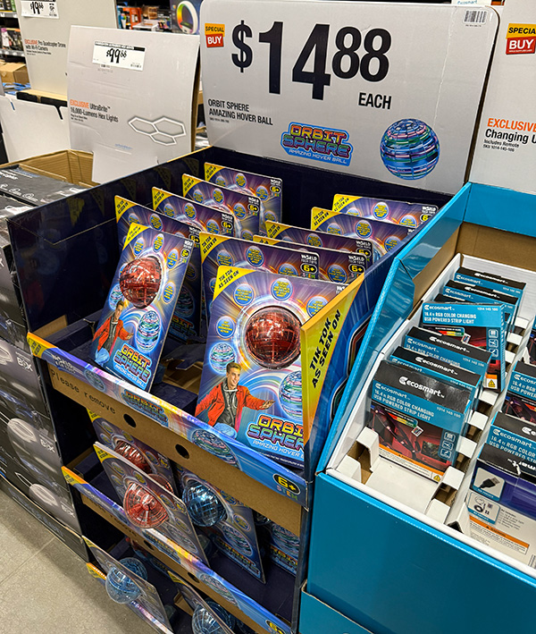 A retail display rack featuring various tools and gadgets promoted on social media during the holidays.