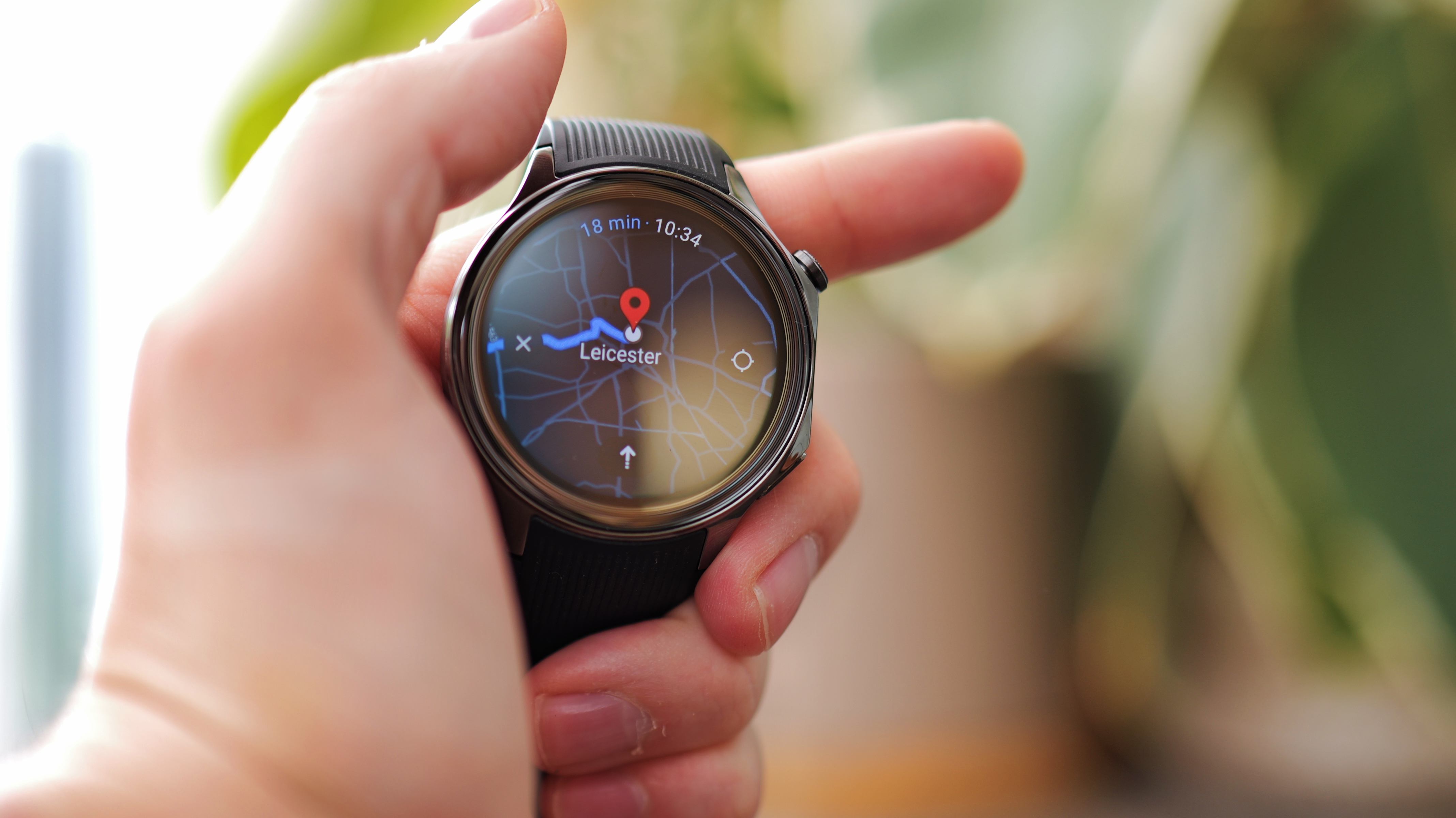 A user interacting with the OnePlus Watch 2 showing smart notification features.