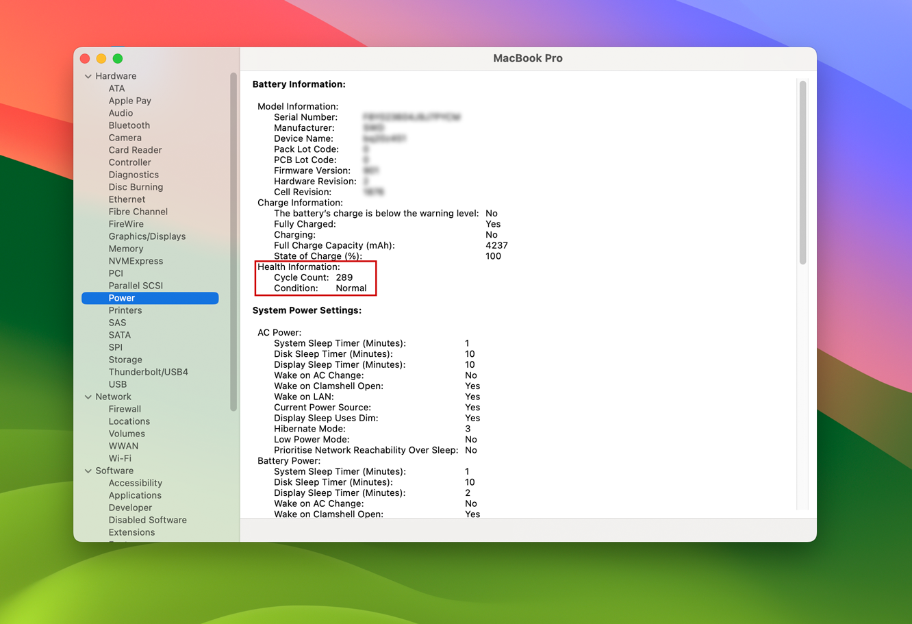 System information panel showing battery cycle count and capacity details.