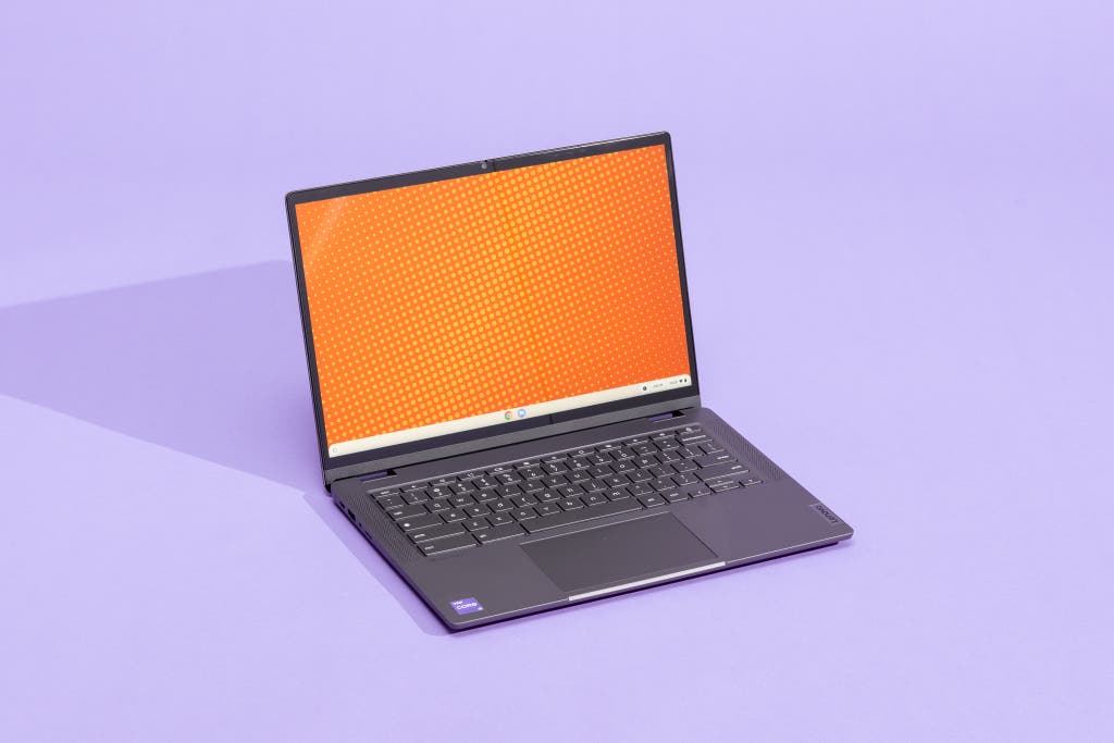 Lenovo IdeaPad Flex 5i Chromebook Plus in tent mode with an orange screen.