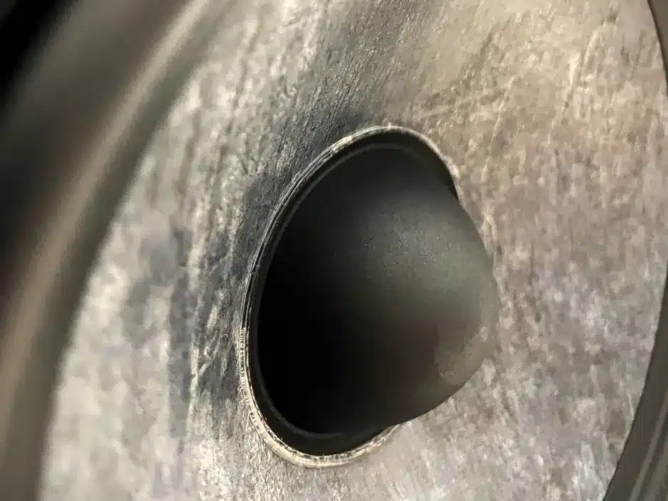 Side profile of a Focal Theva N1 monitor speaker showing its elegant wood and dark finish.