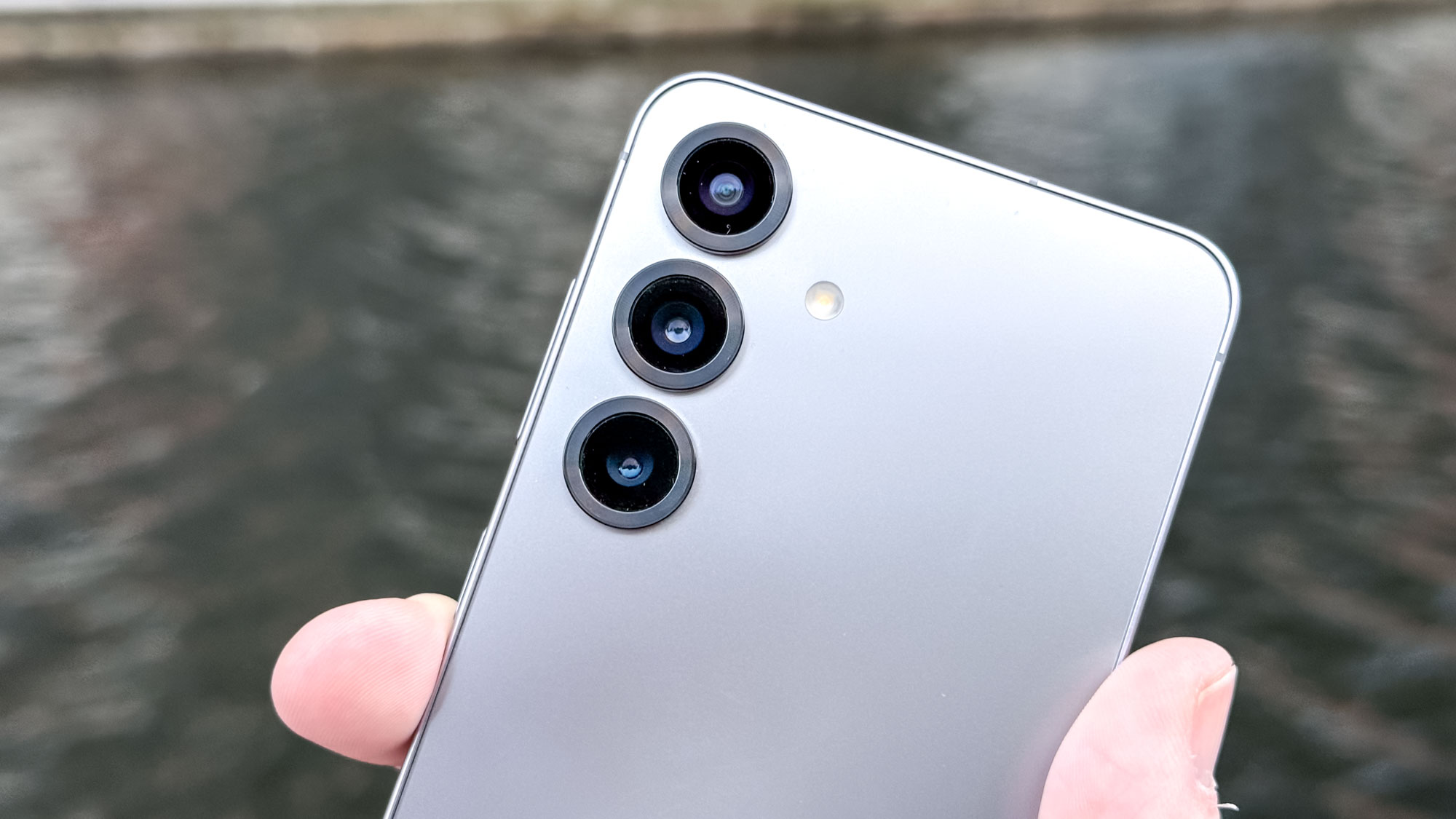 Macro photograph of the rear camera lenses of a Samsung Galaxy S25.