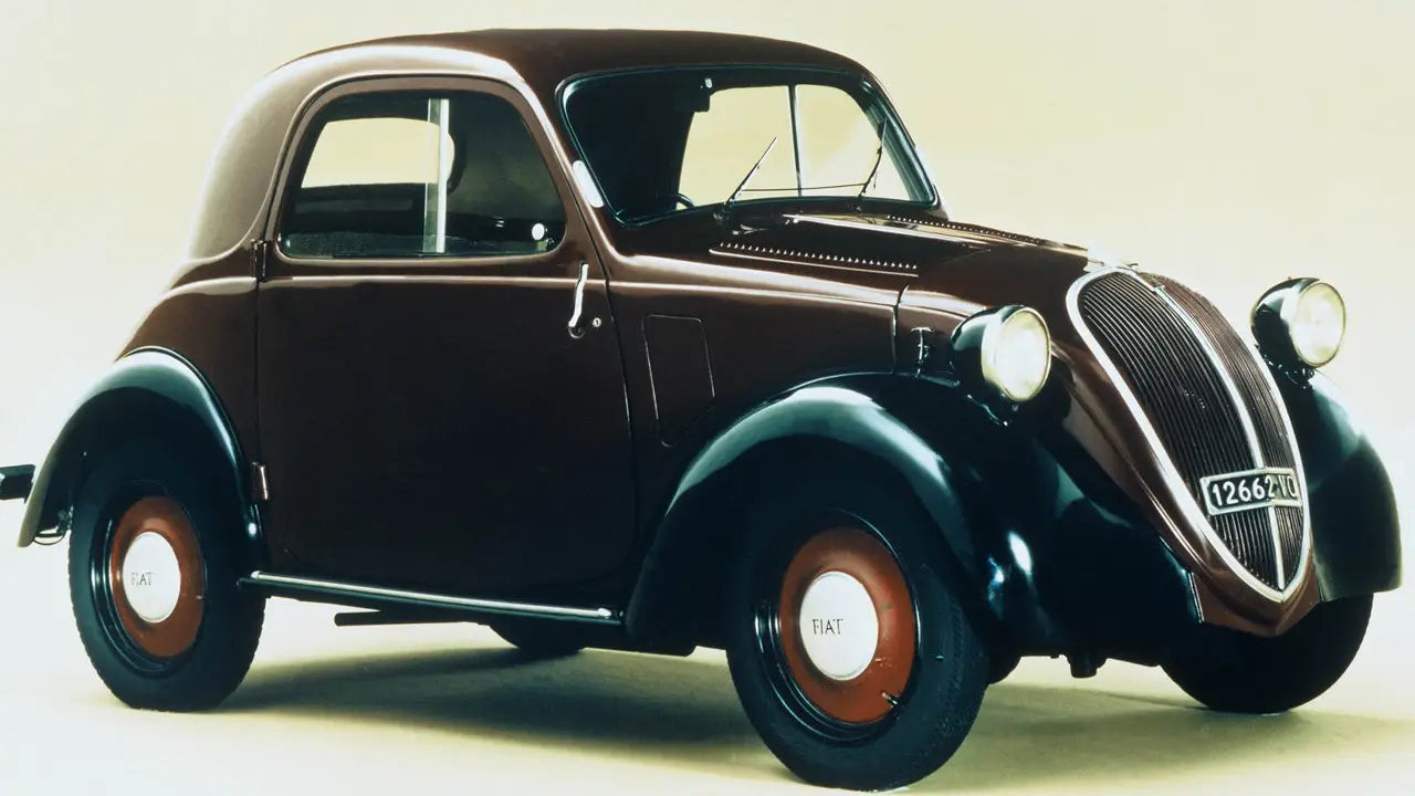 Vintage 1936 Fiat Topolino 500 in a classic setting