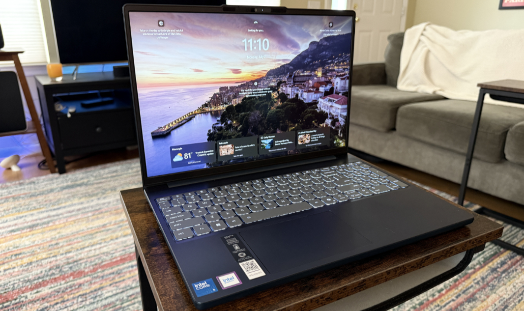 Full view of the open Lenovo IdeaPad Slim 3 laptop in Cosmic Blue showing its thin profile and clean layout.