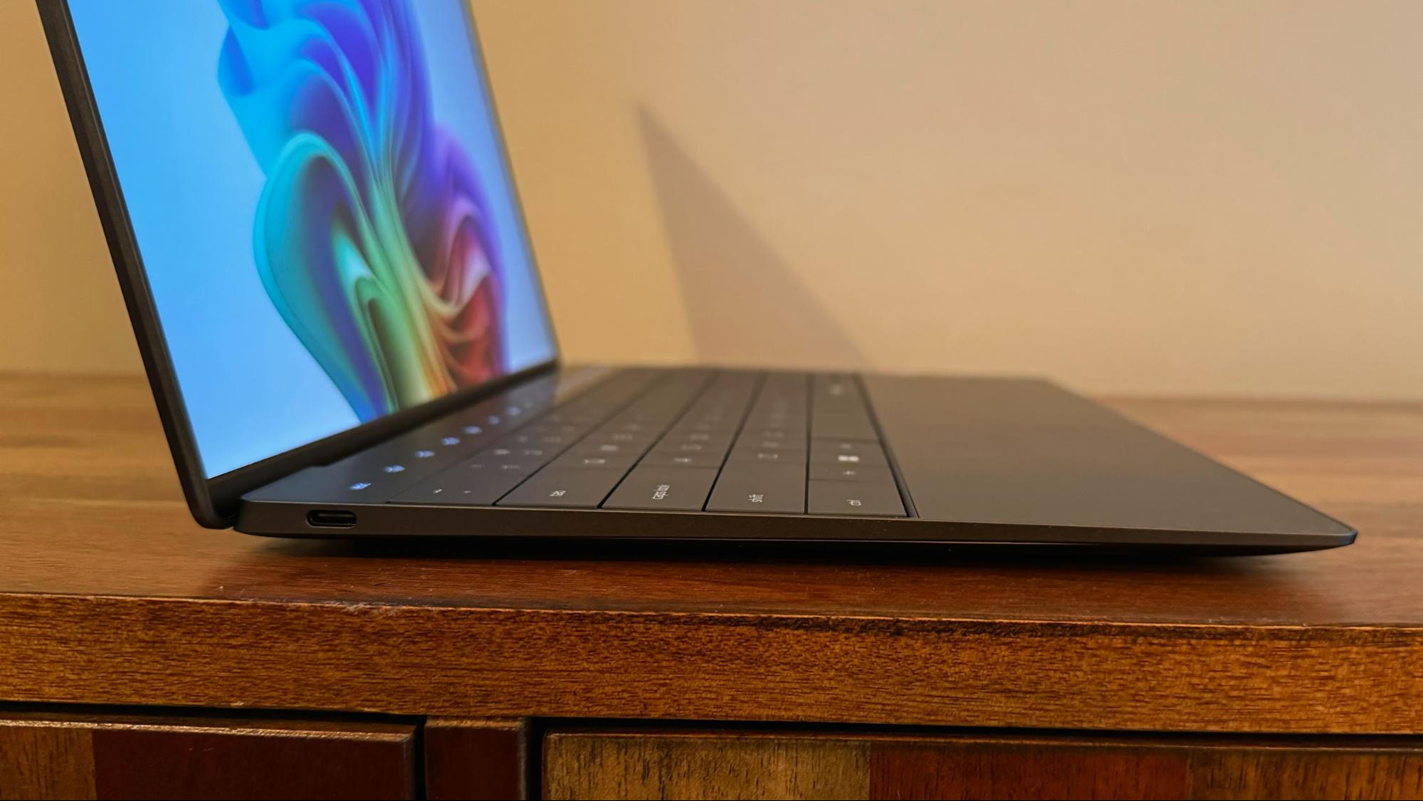 Top-down view of the Dell XPS 13 zero-lattice keyboard and seamless glass touchpad.