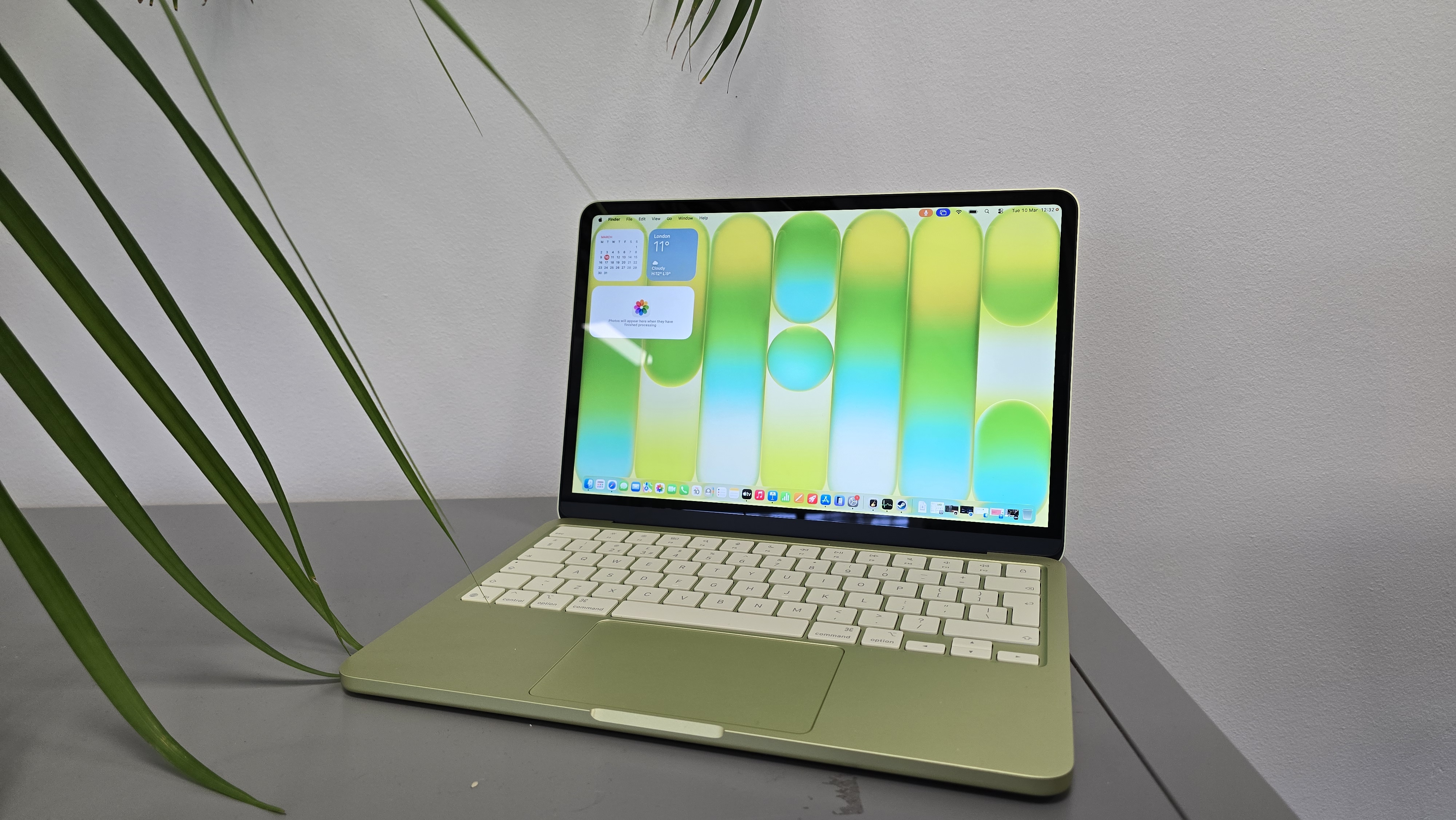 The MacBook Neo, Apple's budget-tier laptop, sitting on a wooden desk.