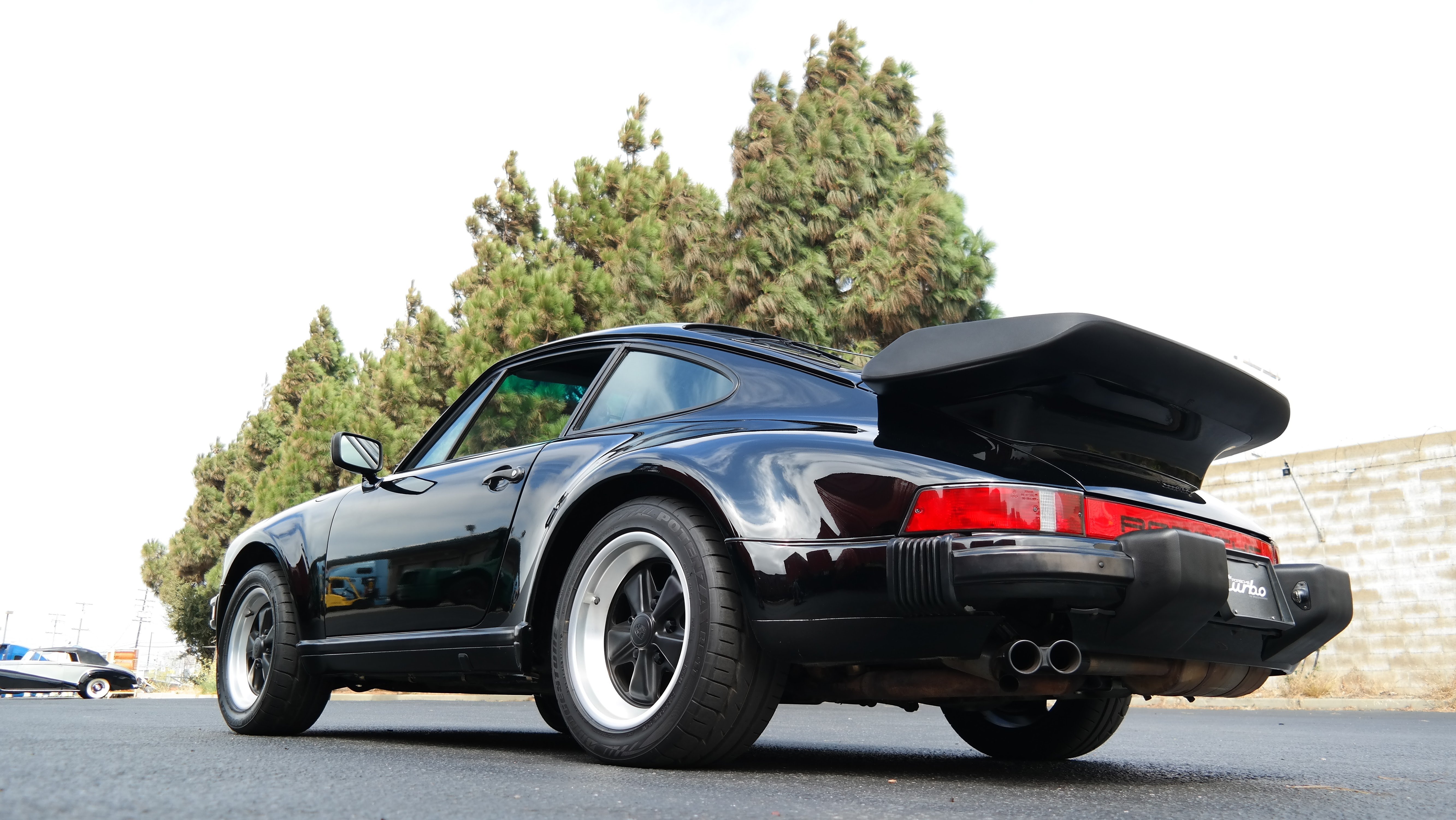 Banner for international classic car shipping and logistics featuring a cargo ship.