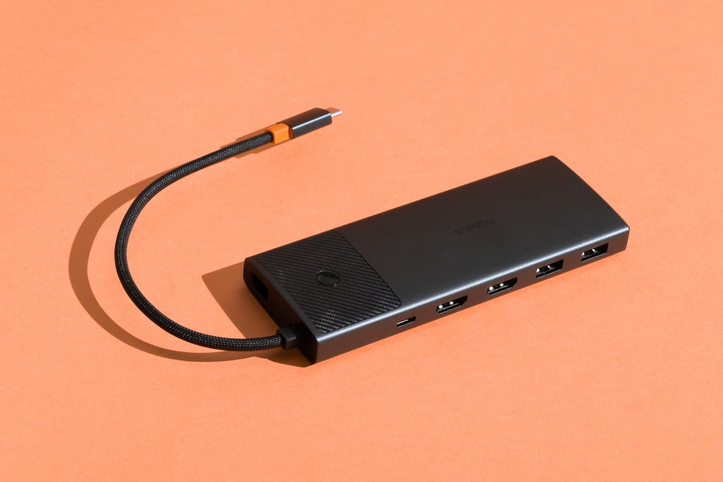 The Baseus 10-in-1 USB-C docking station showing its multiple port outputs.