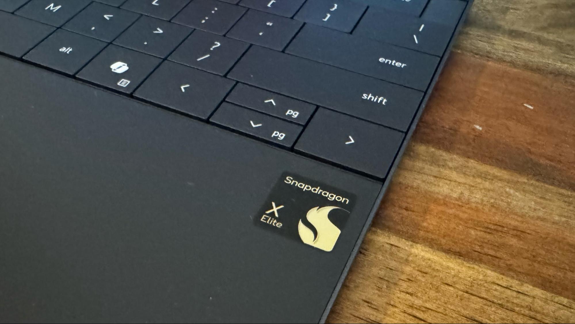 Detail shot of the LED-lit capacitive touch function row above the Dell XPS keyboard.